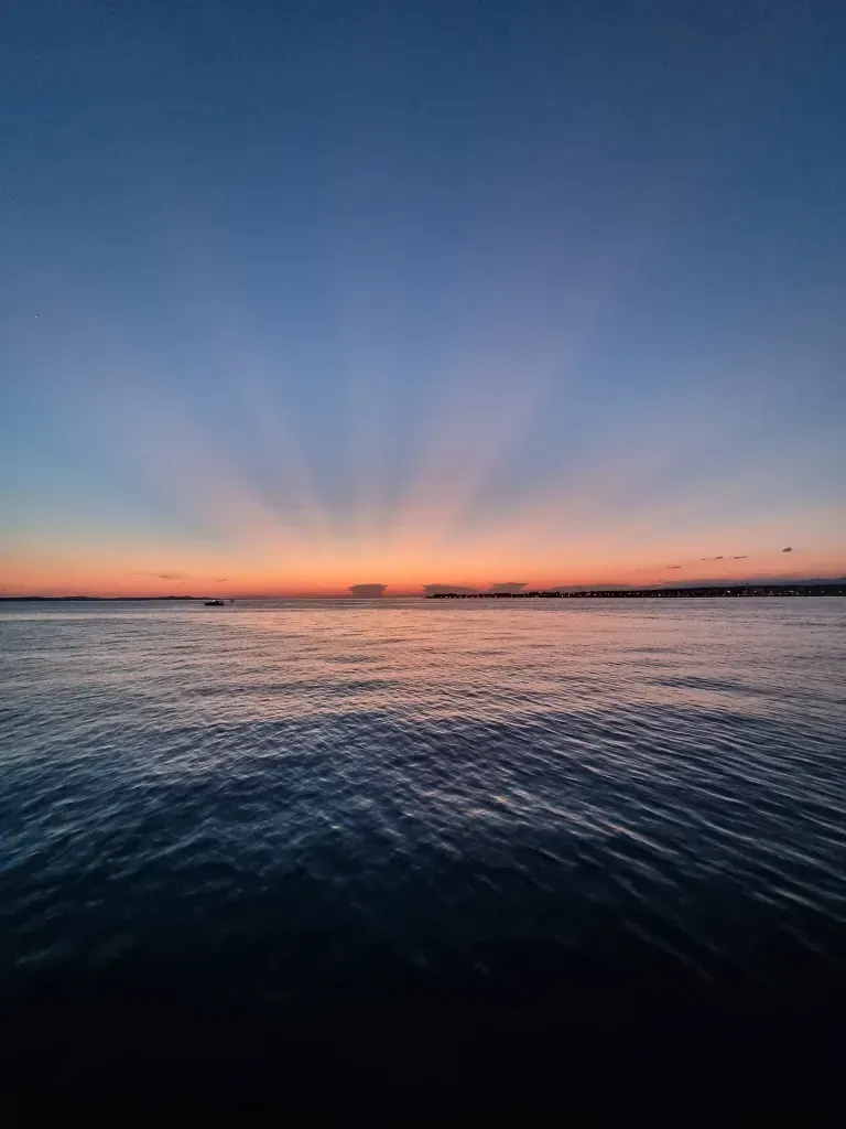 Calm Adriatic sea at sunset with warm golden light